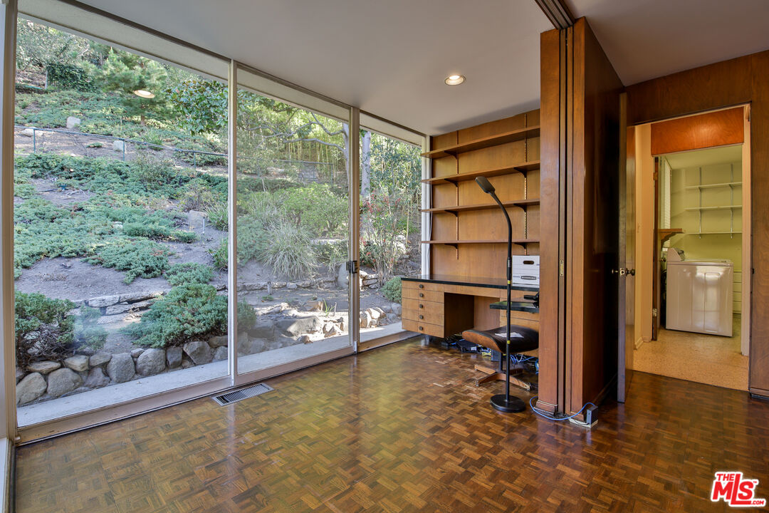 1749 Mandeville Lane Los Angeles, CA 90049 - Photo 10 of 38 a view of a room with gym equipment and floor to ceiling window