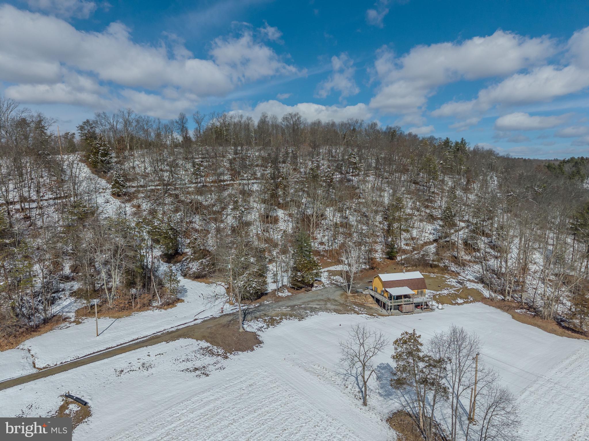 21697 View Drive Three Springs, PA 17264 - Photo 1 of 66 Serene winter retreat amidst snowy hills.