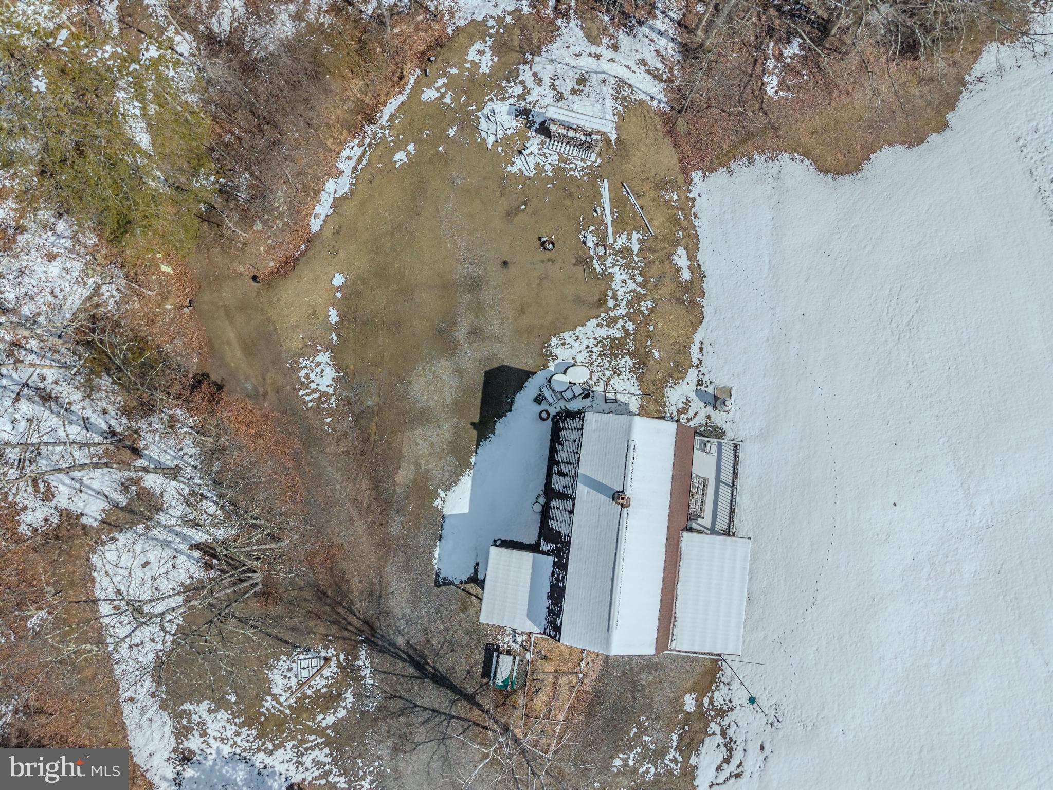 21697 View Drive Three Springs, PA 17264 - Photo 29 of 66 Snow-kissed retreat amidst nature's embrace.