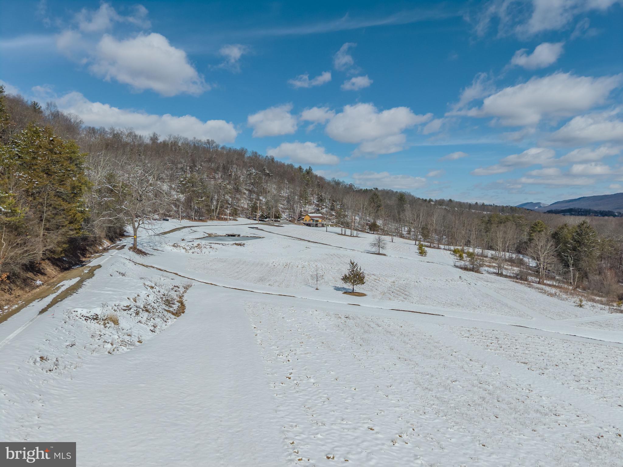 21697 View Drive Three Springs, PA 17264 - Photo 42 of 66 Serene winter landscape under a blue sky.