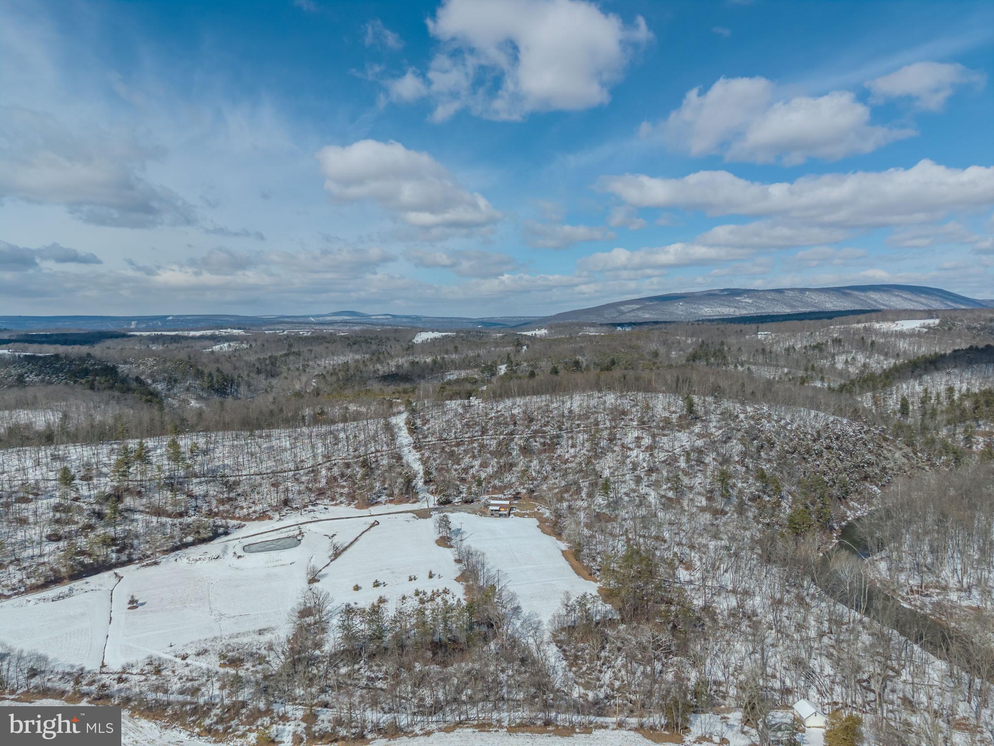 21697 View Drive Three Springs, PA 17264 - Photo 44 of 66 Snowy hills under a vast blue sky.