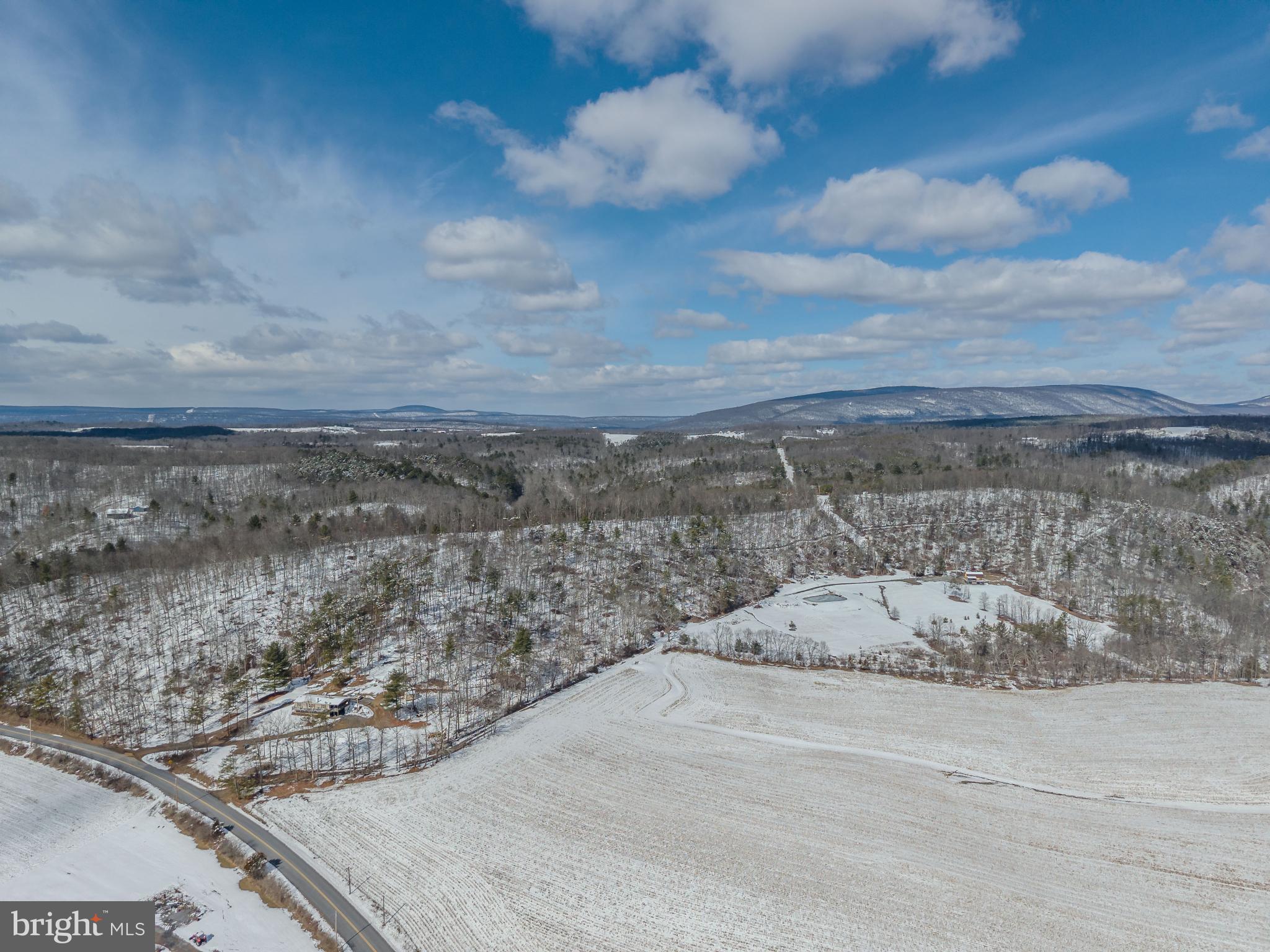 21697 View Drive Three Springs, PA 17264 - Photo 45 of 66 Serene winter landscape under vast skies.