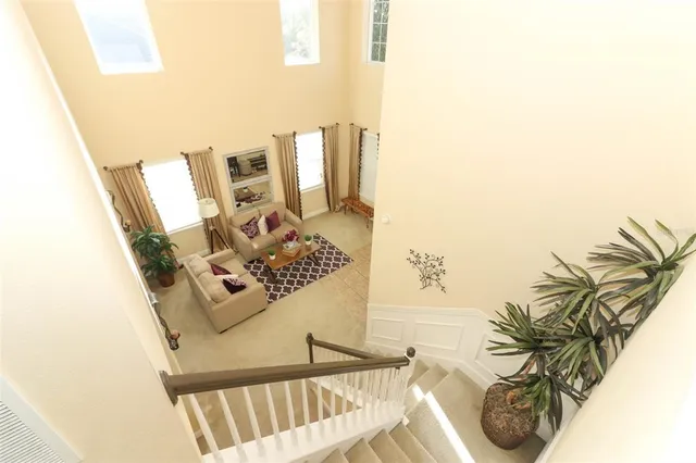 a view of living room with furniture and a rug