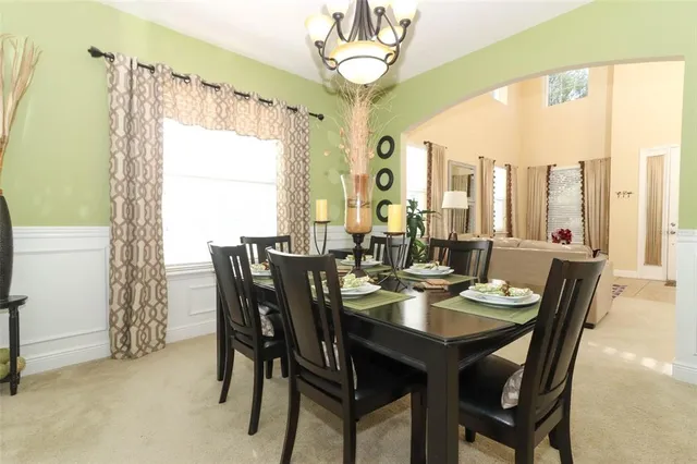 a view of a dining room with furniture window and outside view