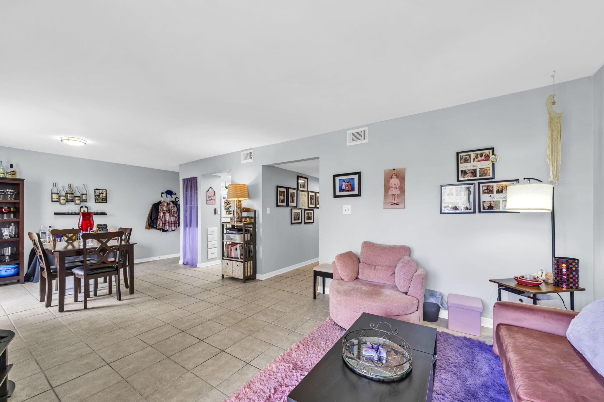 308 Miracle Strip Parkway Southwest, Unit 1B Fort Walton Beach, FL 32548 - Photo 15 of 42 a living room with furniture and wooden floor