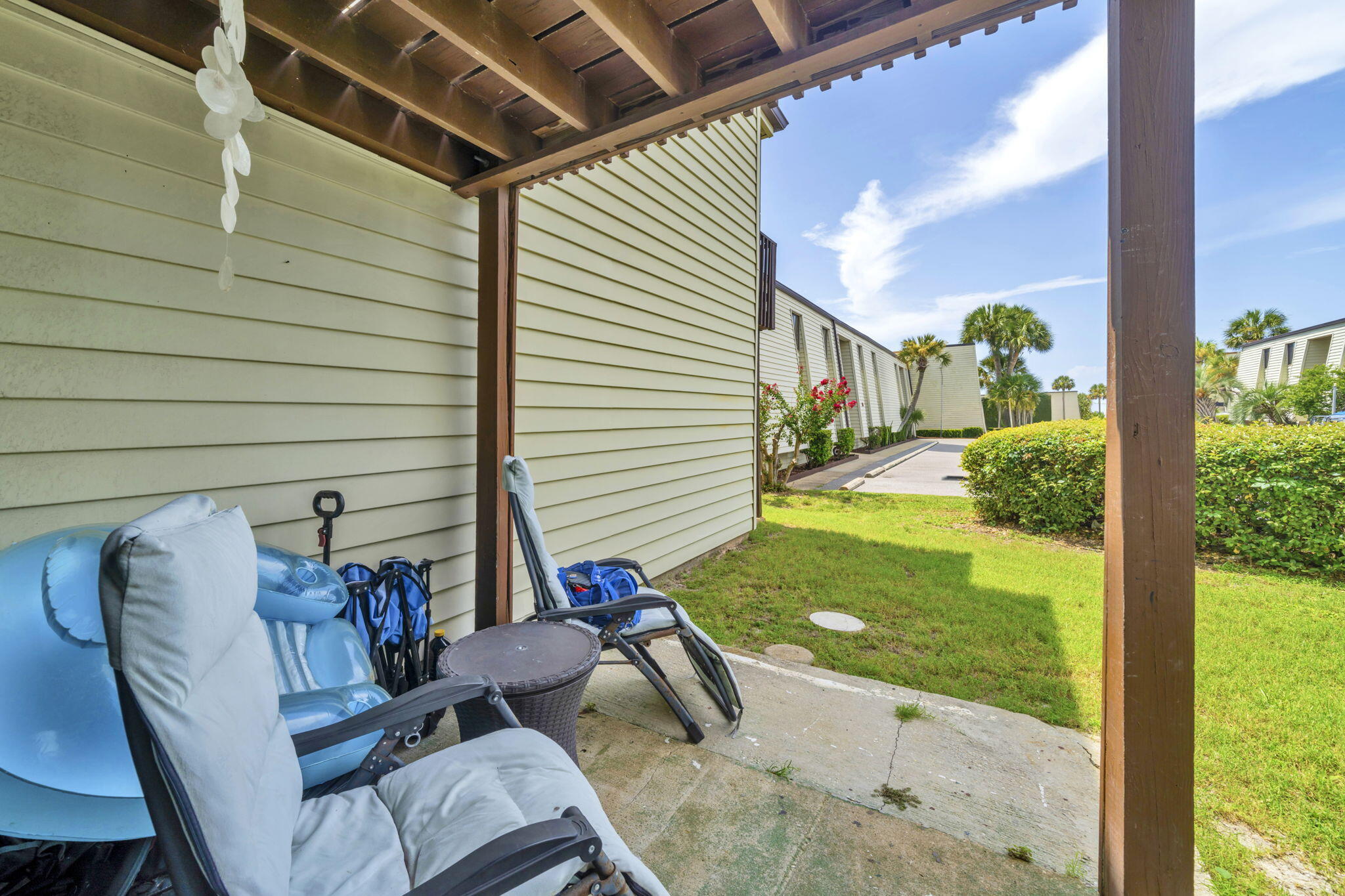308 Miracle Strip Parkway Southwest, Unit 1B Fort Walton Beach, FL 32548 - Photo 23 of 42 a view of backyard with seating space