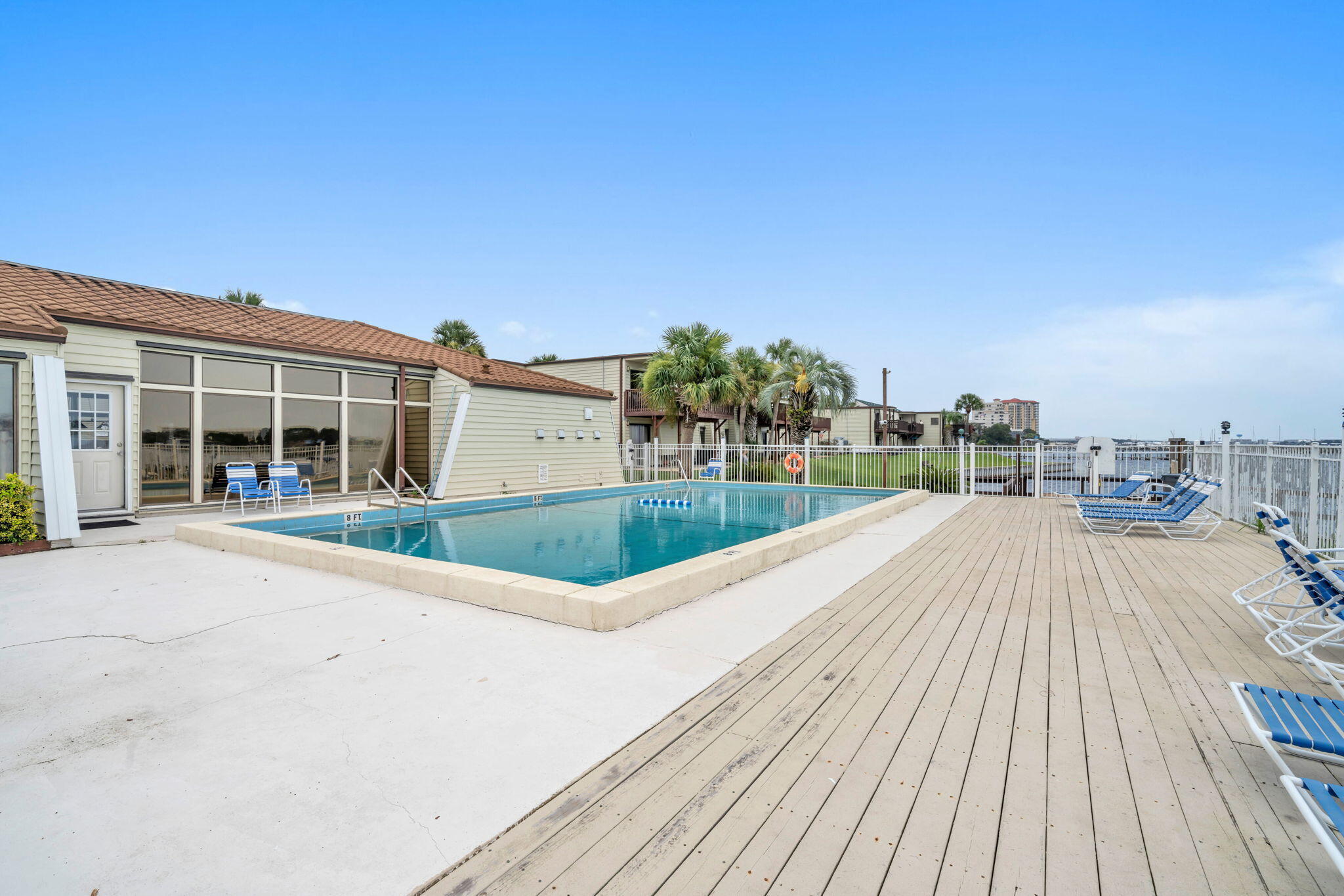 308 Miracle Strip Parkway Southwest, Unit 1B Fort Walton Beach, FL 32548 - Photo 28 of 42 a view of a house with a patio