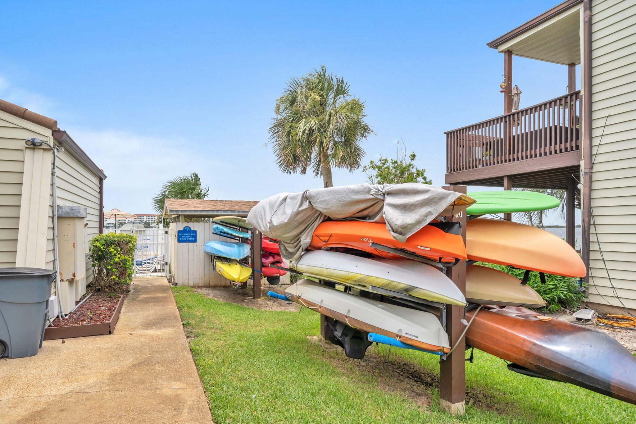 308 Miracle Strip Parkway Southwest, Unit 1B Fort Walton Beach, FL 32548 - Photo 35 of 42 a backyard of a house with outdoor seating