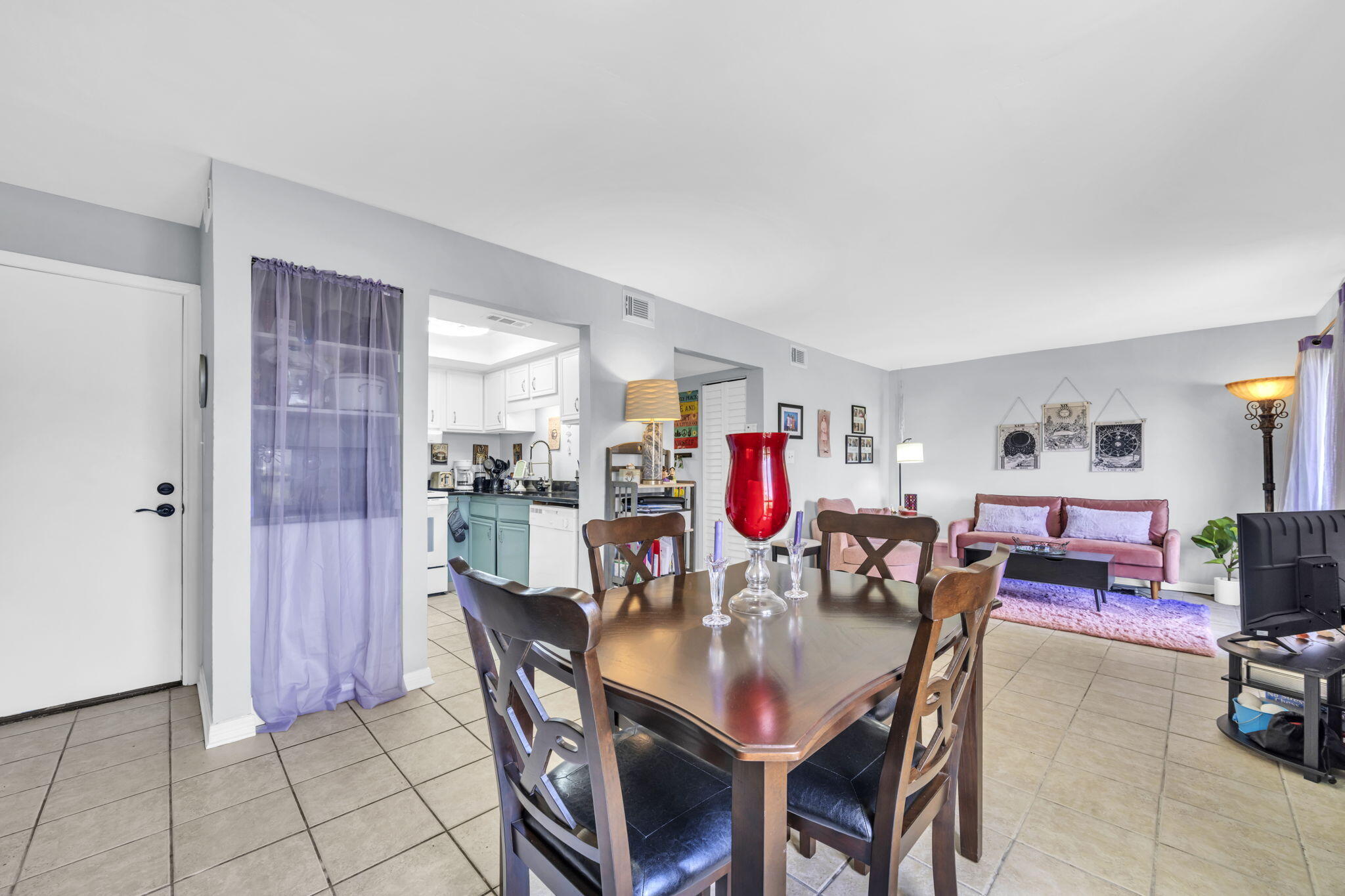 308 Miracle Strip Parkway Southwest, Unit 1B Fort Walton Beach, FL 32548 - Photo 5 of 42 a view of a dining room with furniture and rug