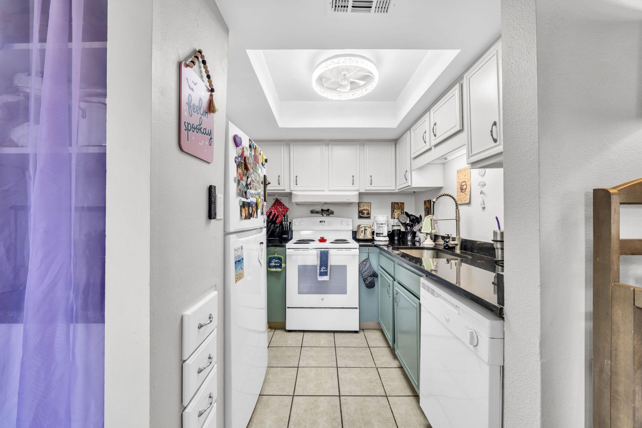 308 Miracle Strip Parkway Southwest, Unit 1B Fort Walton Beach, FL 32548 - Photo 6 of 42 a kitchen with stainless steel appliances granite countertop a refrigerator and a stove