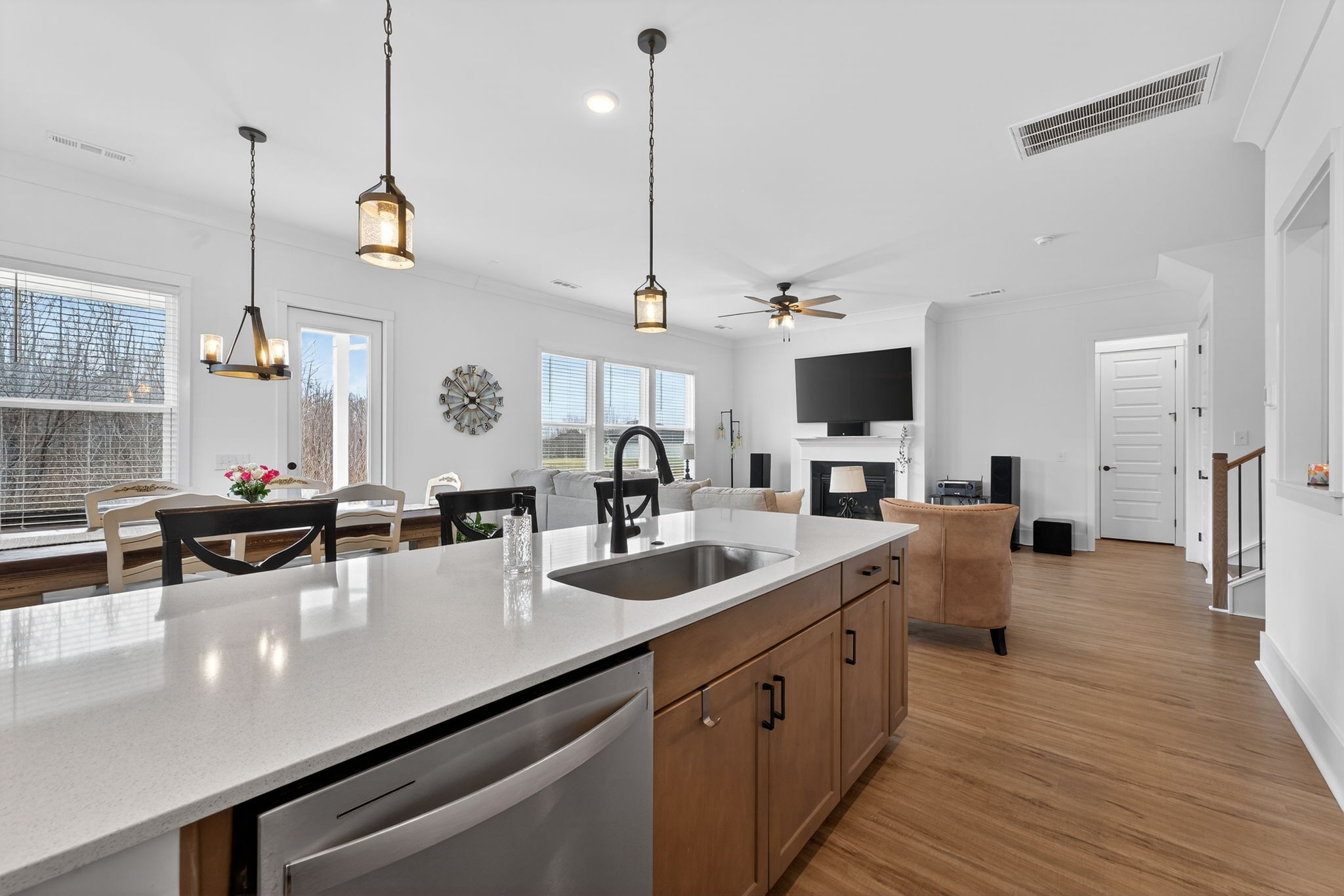 7780 Second Fiddle Way Arrington, TN 37014 - Photo 11 of 37 a view of a kitchen with kitchen island a sink stainless steel appliances and living room view