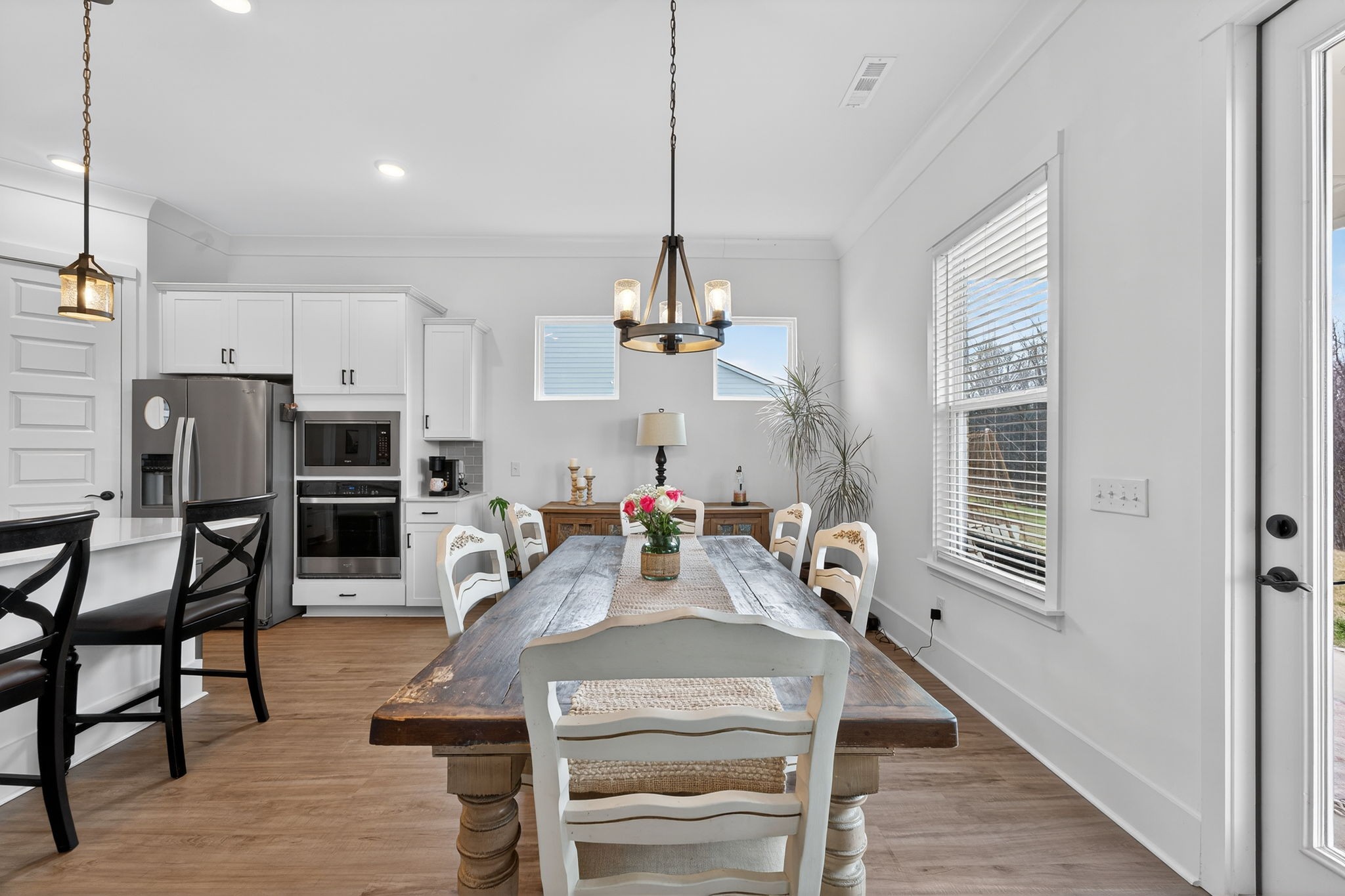 7780 Second Fiddle Way Arrington, TN 37014 - Photo 16 of 37 a view of a dining room with furniture window and wooden floor