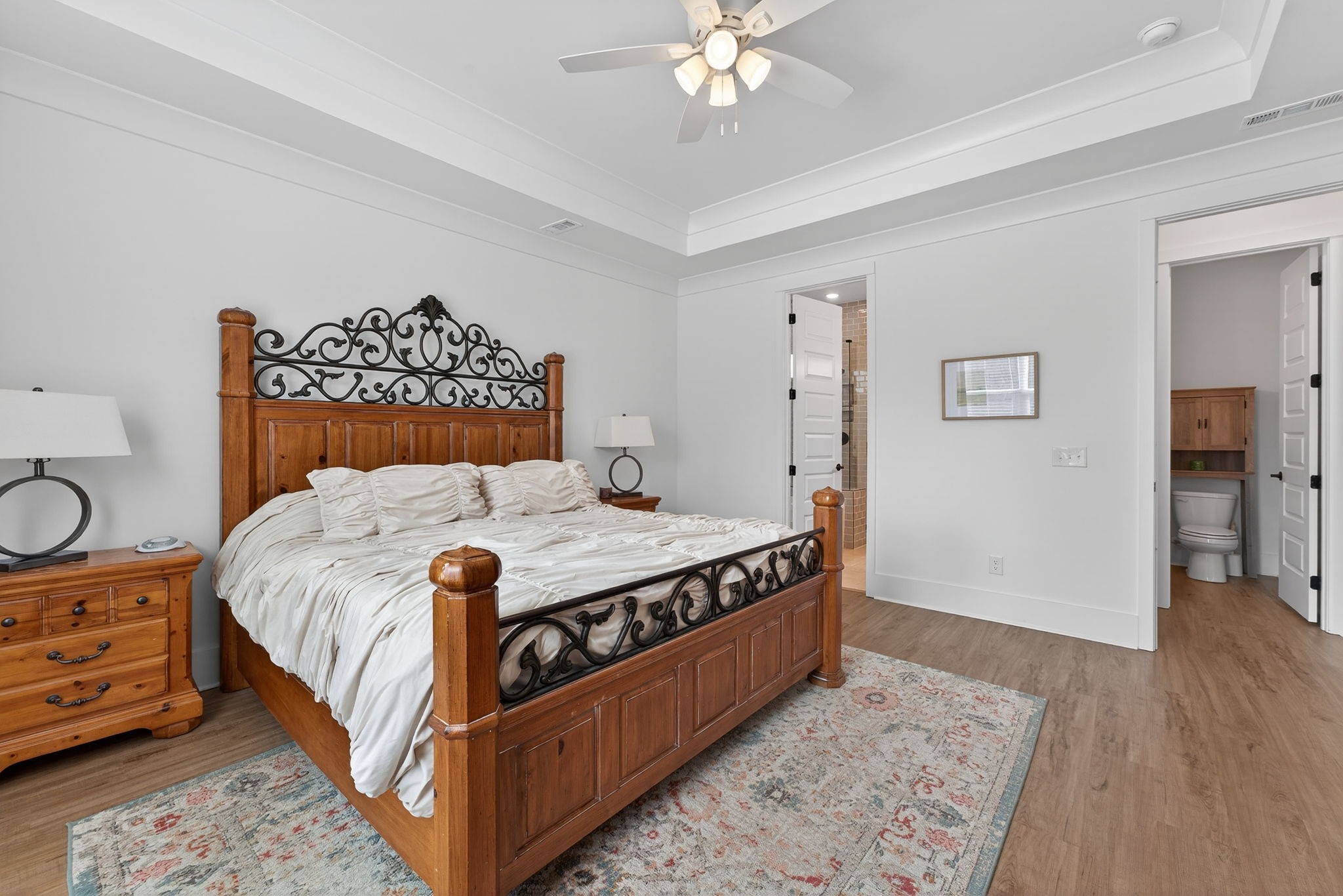 7780 Second Fiddle Way Arrington, TN 37014 - Photo 20 of 37 a bed sitting in a spacious bedroom next to a cabinet