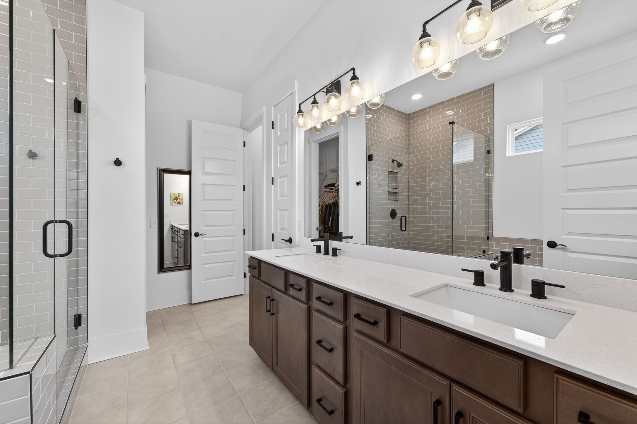 7780 Second Fiddle Way Arrington, TN 37014 - Photo 22 of 37 a bathroom with a double vanity sink mirror and double
