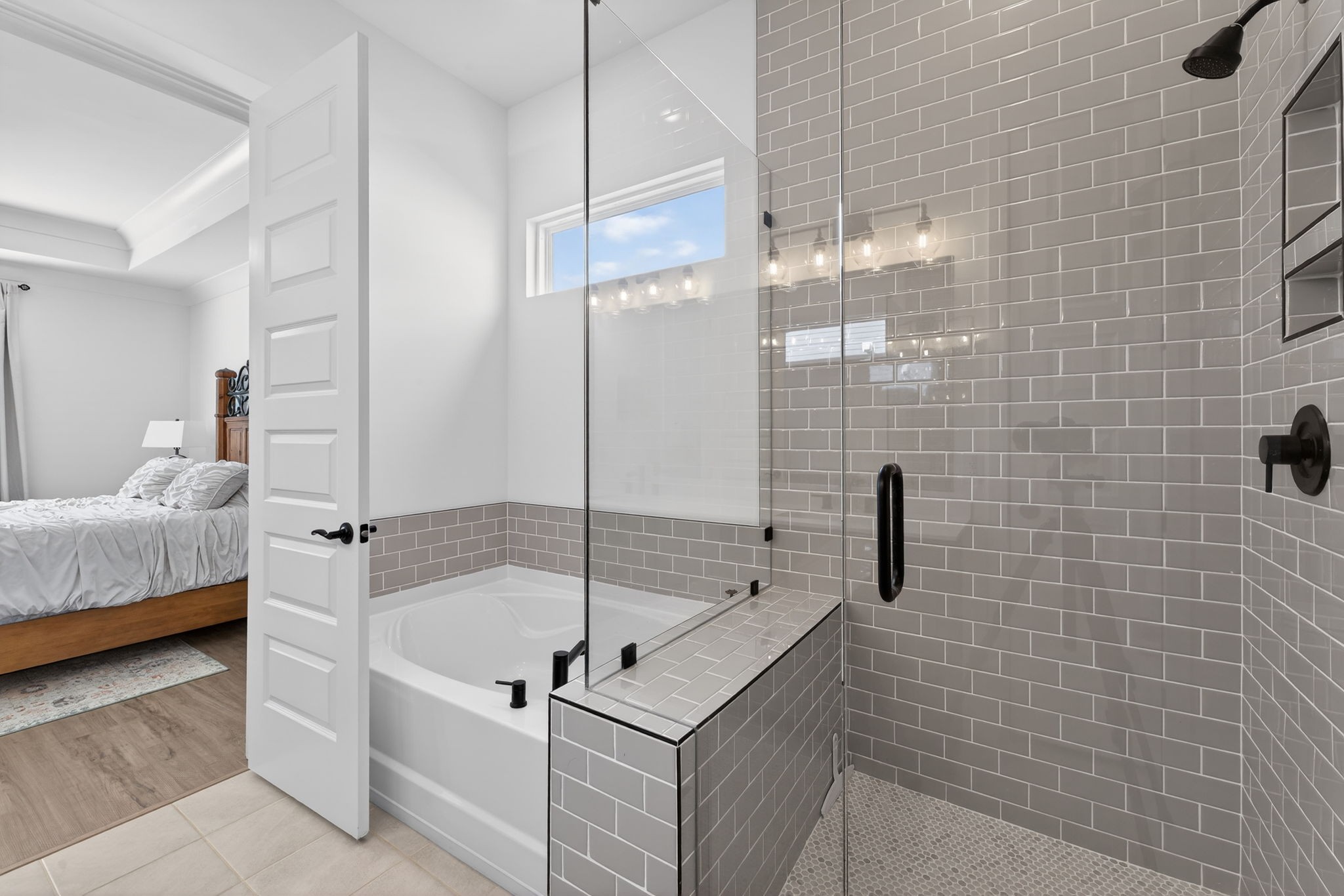 7780 Second Fiddle Way Arrington, TN 37014 - Photo 23 of 37 a bathroom with a tub and a shower