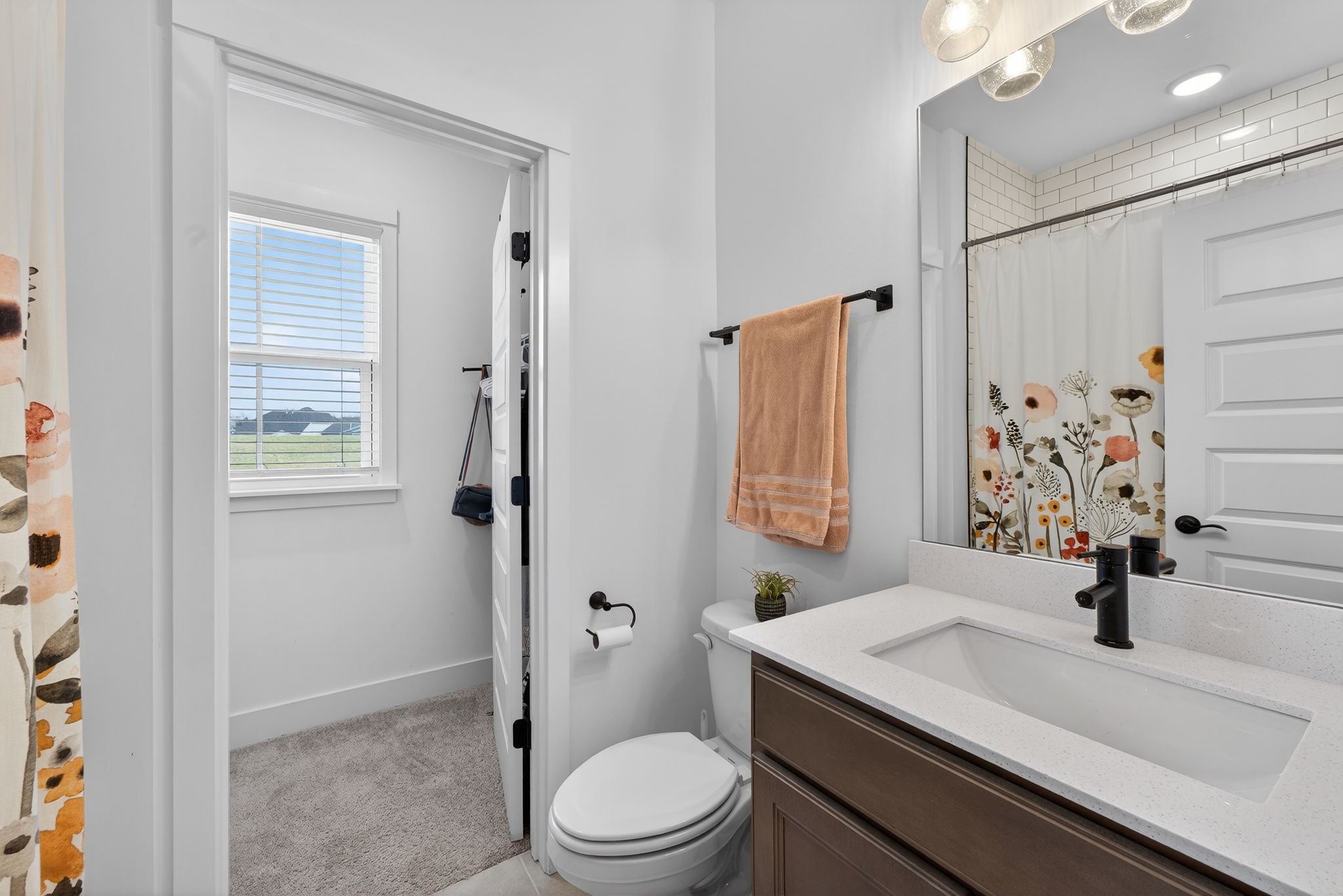 7780 Second Fiddle Way Arrington, TN 37014 - Photo 25 of 37 a bathroom with a sink toilet vanity and shower