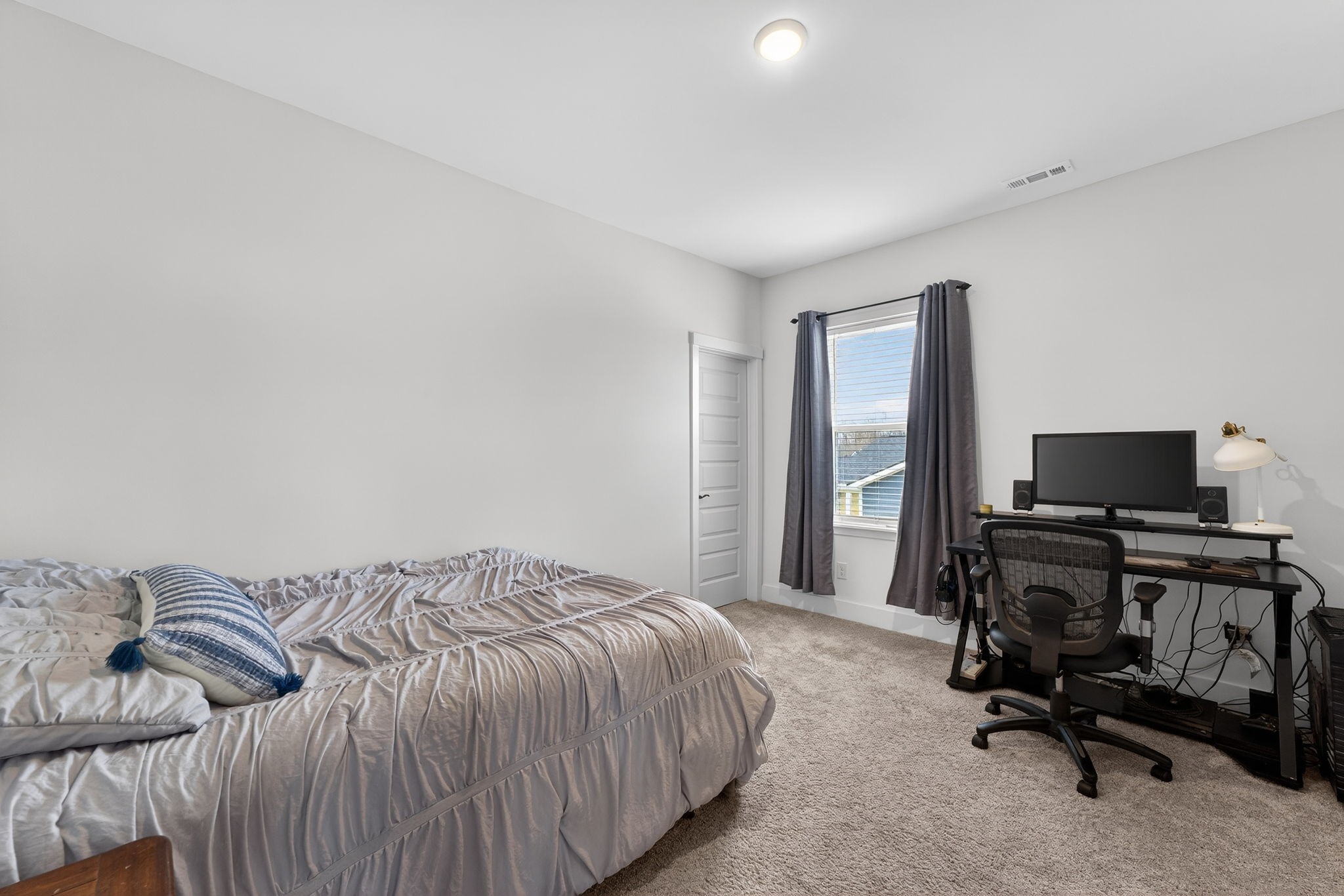 7780 Second Fiddle Way Arrington, TN 37014 - Photo 27 of 37 a bedroom with a bed and a desk