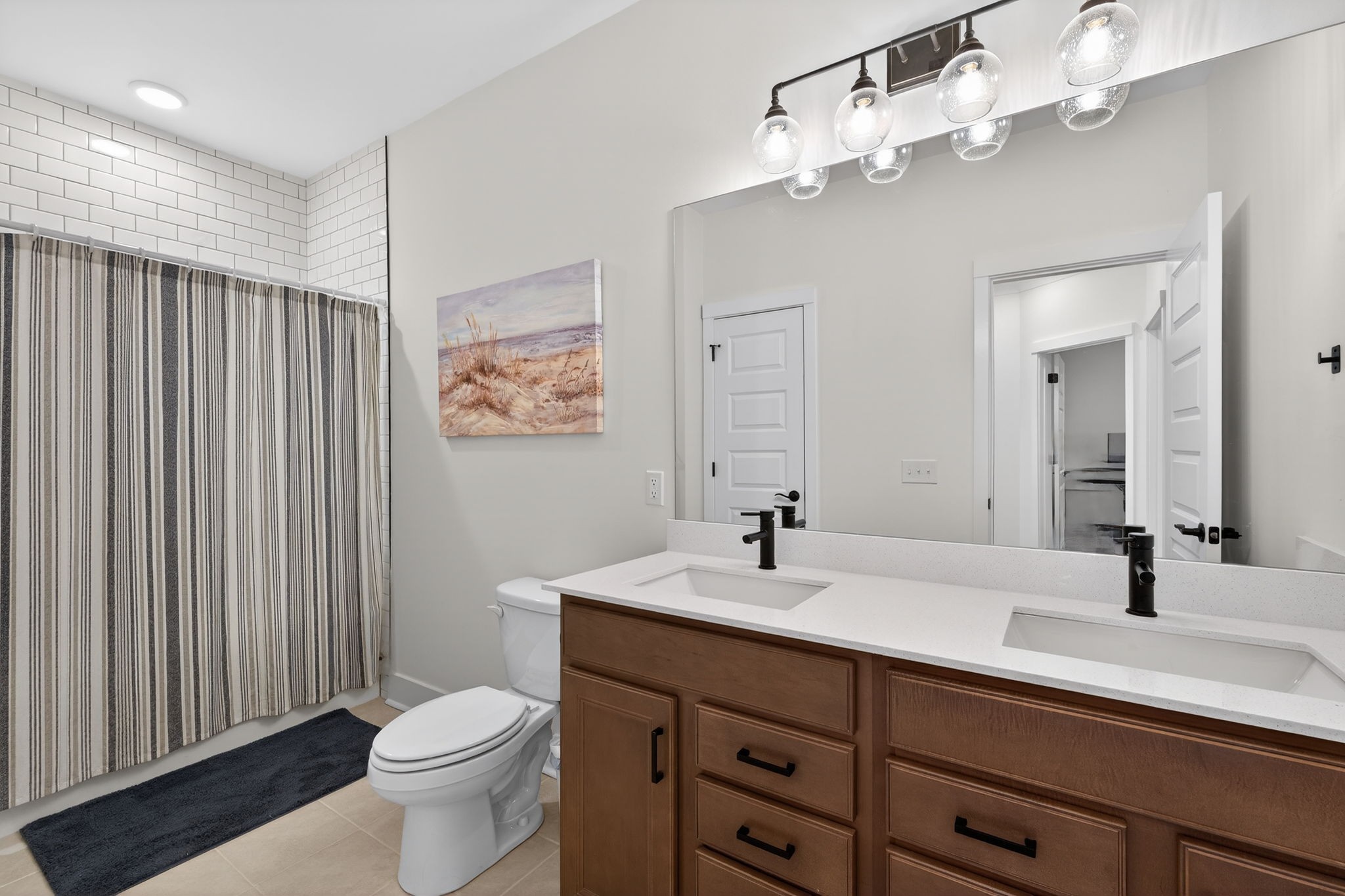 7780 Second Fiddle Way Arrington, TN 37014 - Photo 28 of 37 a bathroom with a double vanity sink mirror and toilet