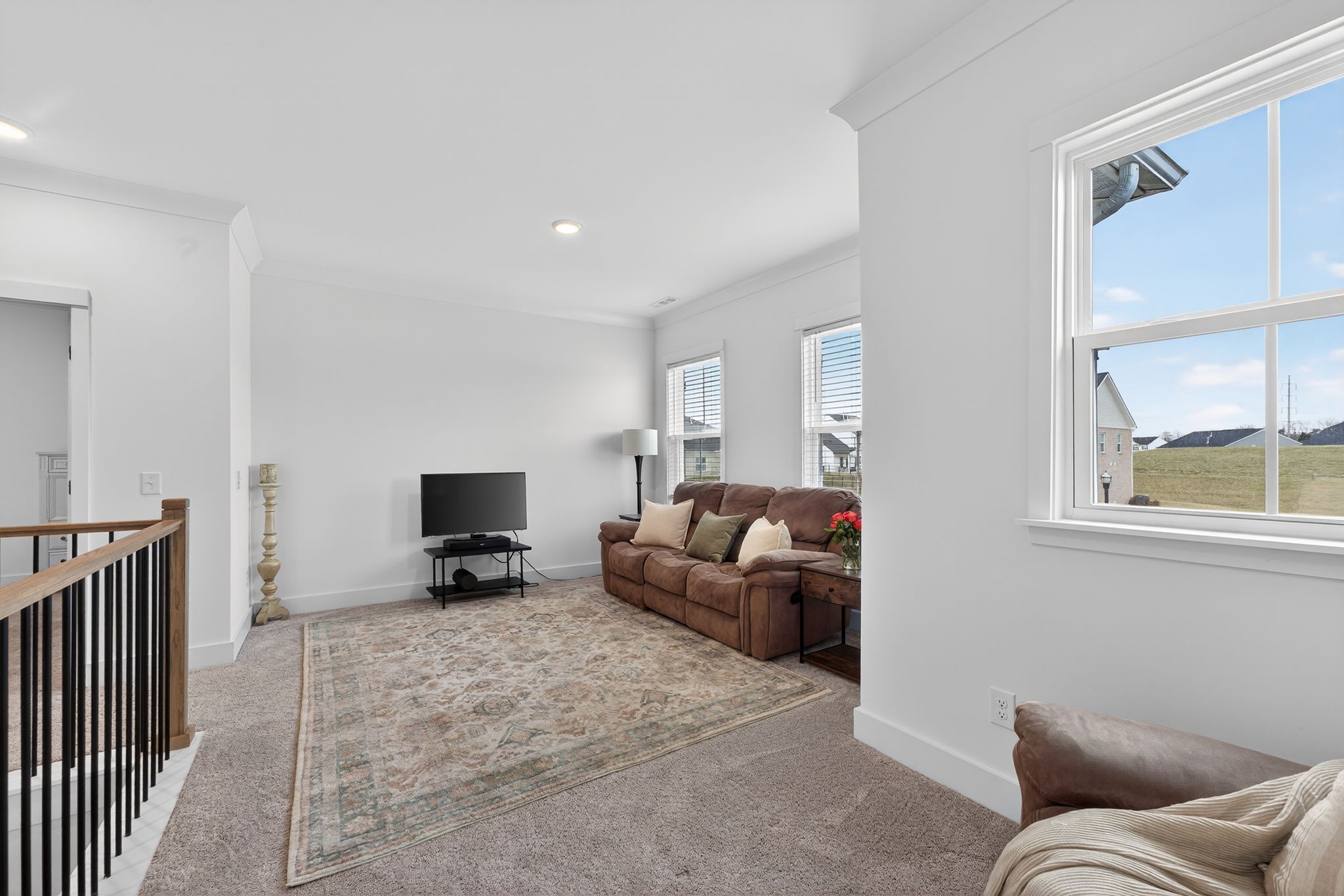 7780 Second Fiddle Way Arrington, TN 37014 - Photo 31 of 37 a living room with furniture a fireplace and a flat tv screen