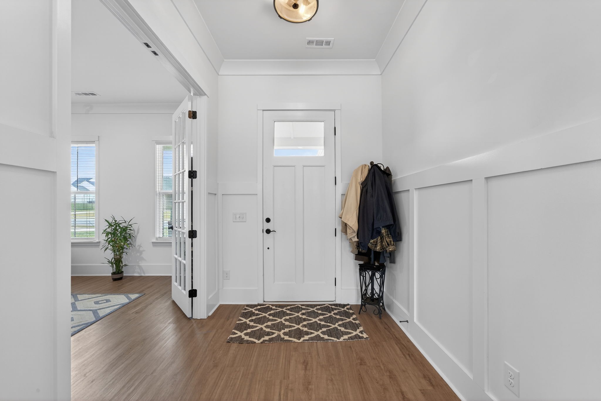 7780 Second Fiddle Way Arrington, TN 37014 - Photo 6 of 37 a view of a hallway with wooden floor and front door