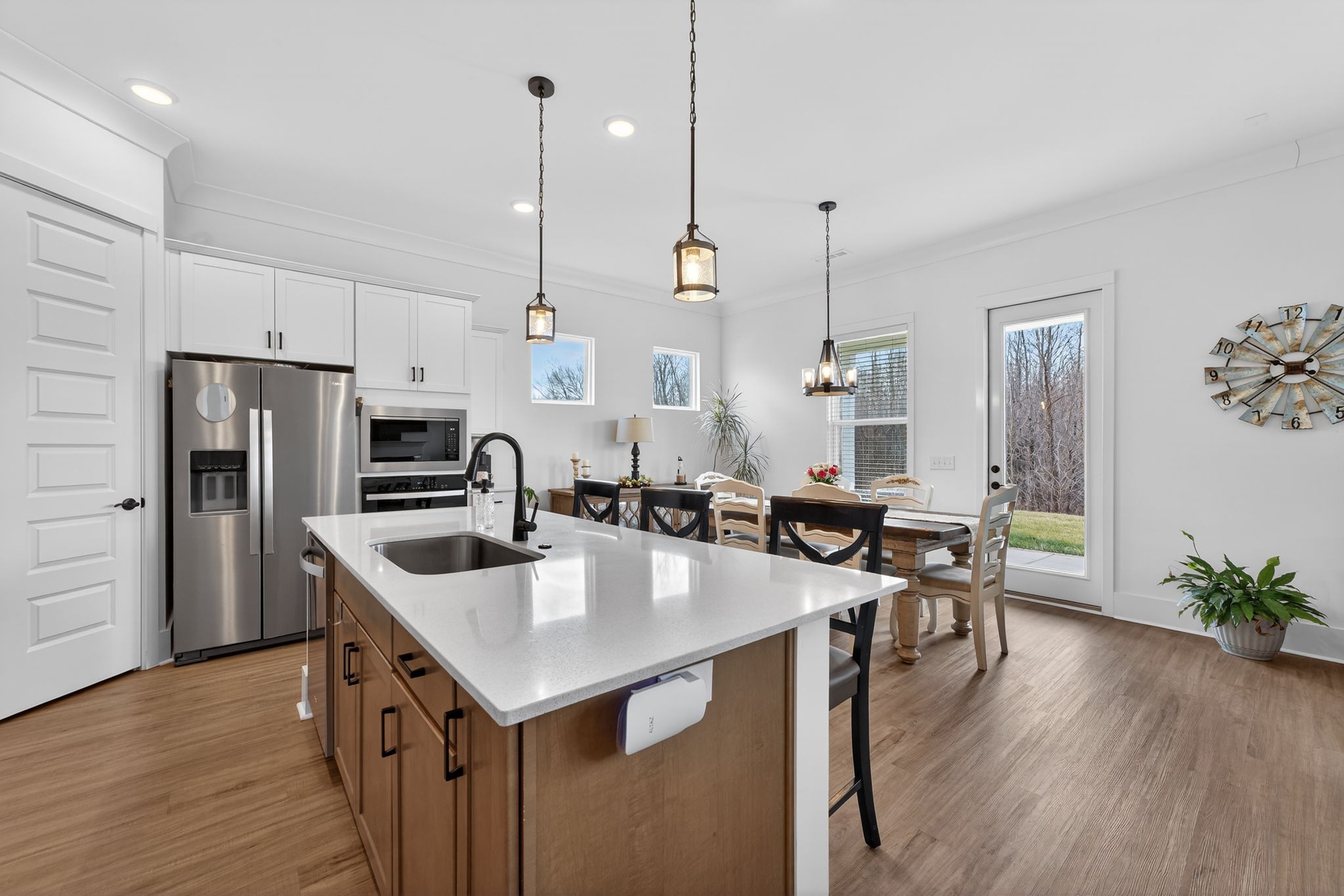 7780 Second Fiddle Way Arrington, TN 37014 - Photo 10 of 37 a large kitchen with sink a refrigerator and chairs