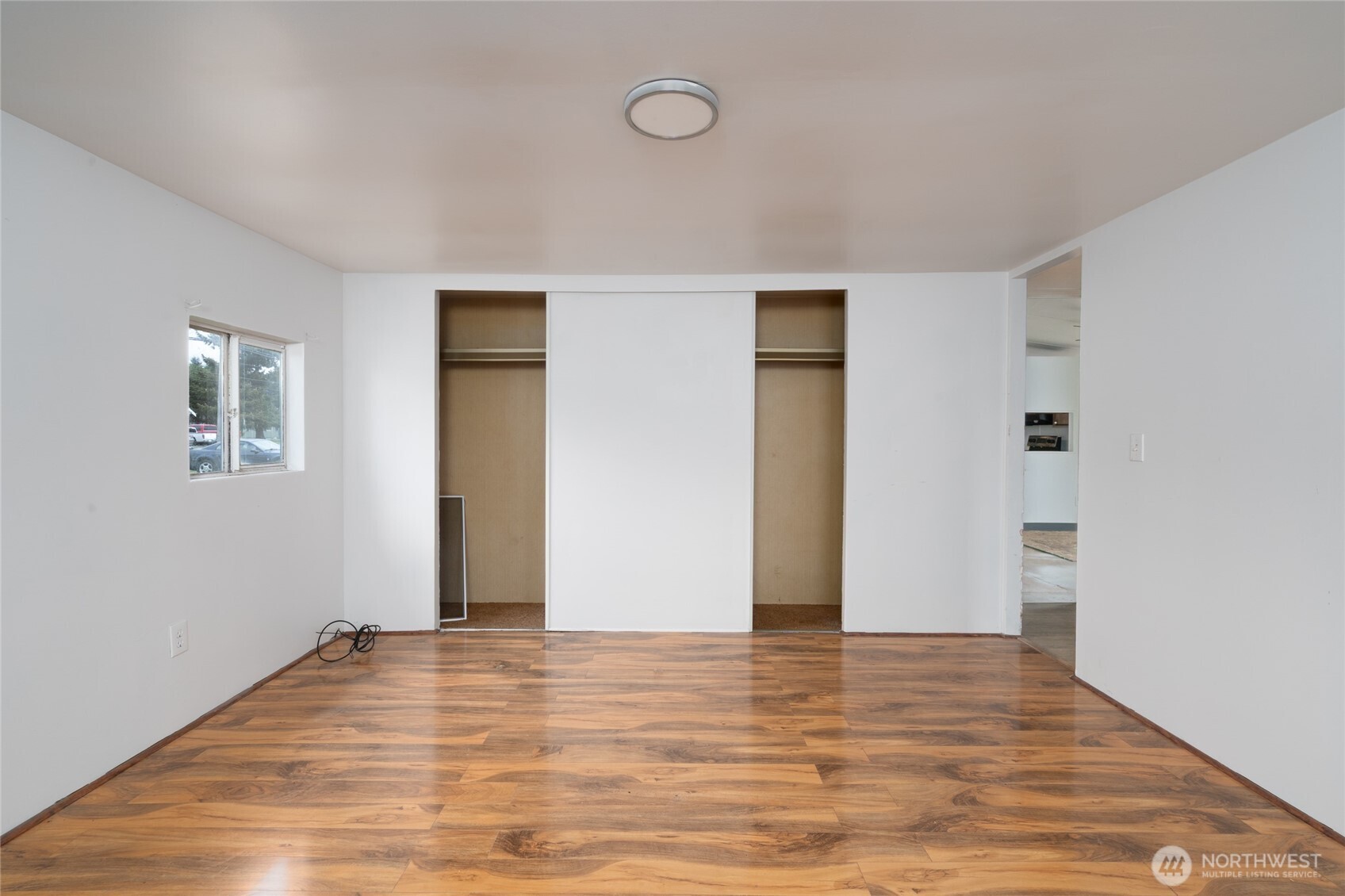 1133 State Street Sedro-Woolley, WA 98284 - Photo 15 of 28 a view of an empty room with wooden floor and closet