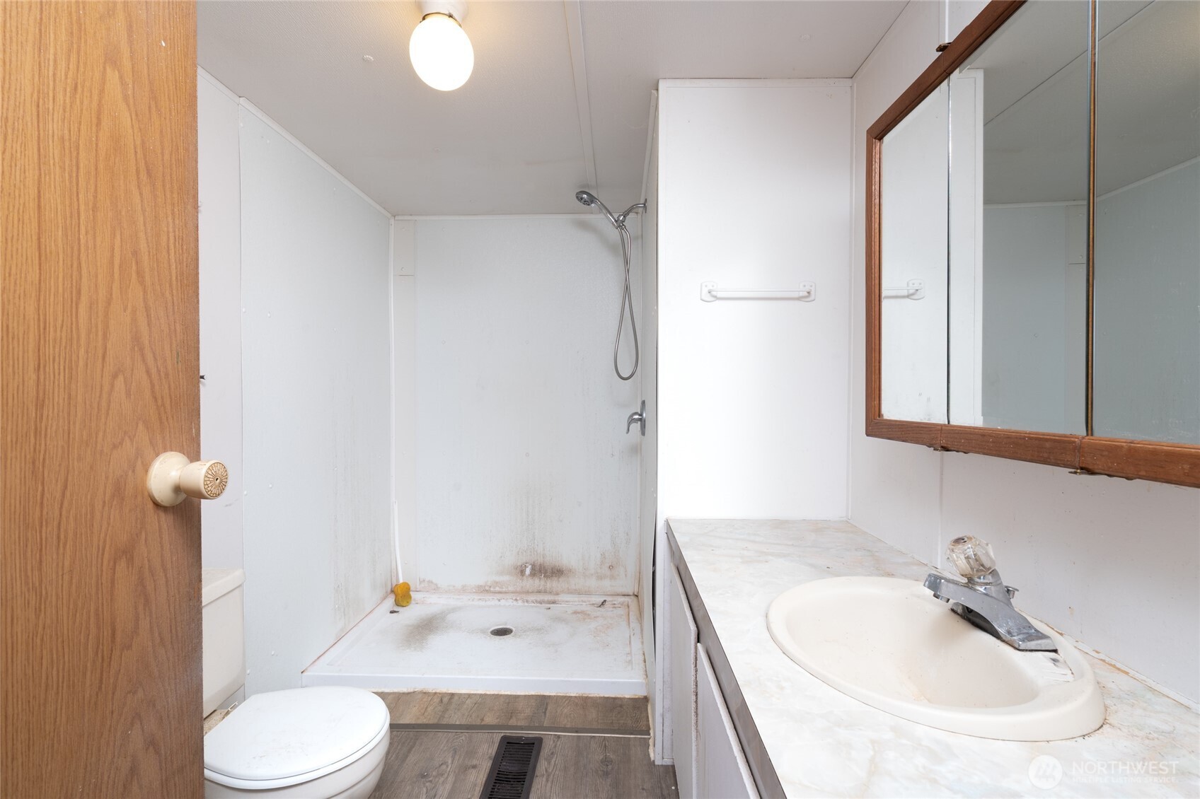 1133 State Street Sedro-Woolley, WA 98284 - Photo 18 of 28 a bathroom with a sink toilet and shower