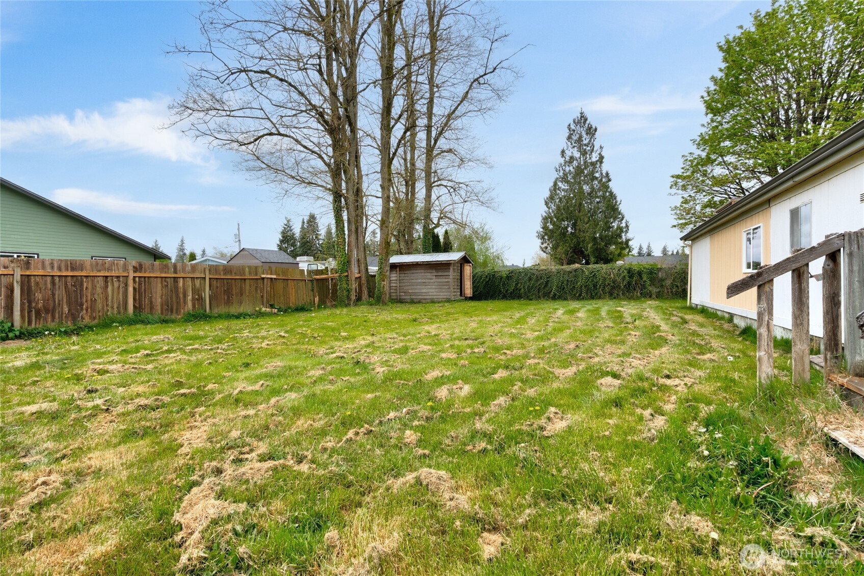 1133 State Street Sedro-Woolley, WA 98284 - Photo 21 of 28 a view of a backyard with table and chairs and wooden fence