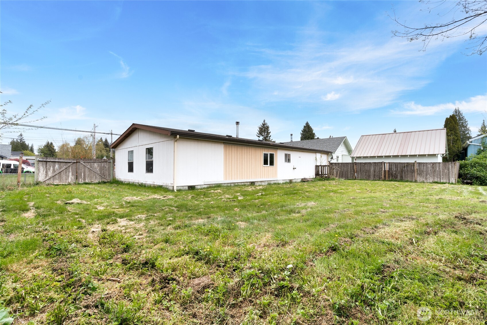 1133 State Street Sedro-Woolley, WA 98284 - Photo 25 of 28 a view of a backyard with plants and large tree