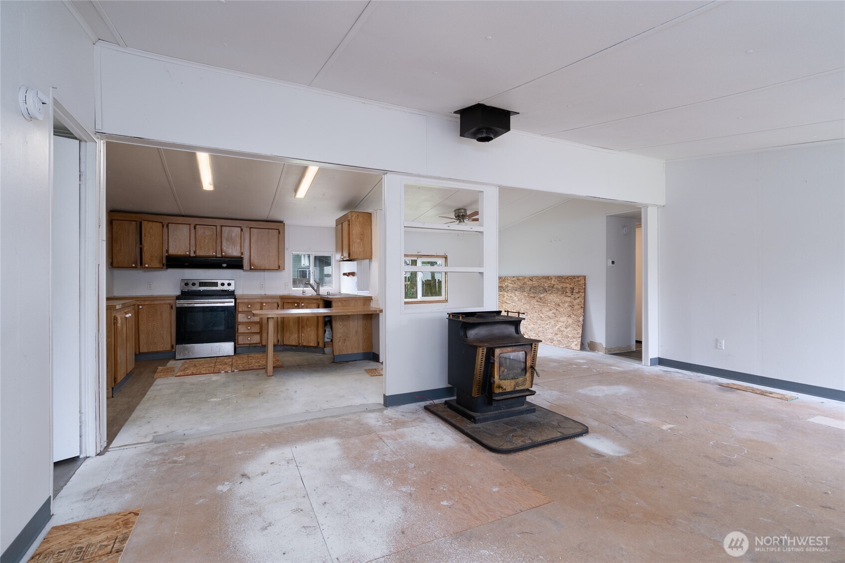 1133 State Street Sedro-Woolley, WA 98284 - Photo 5 of 28 a living room with furniture and a flat screen tv