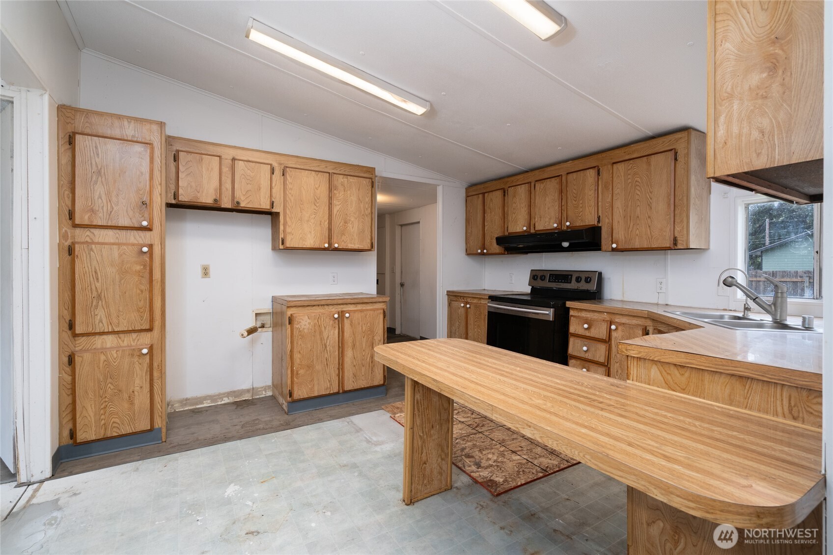 1133 State Street Sedro-Woolley, WA 98284 - Photo 8 of 28 a kitchen with a sink appliances and cabinets