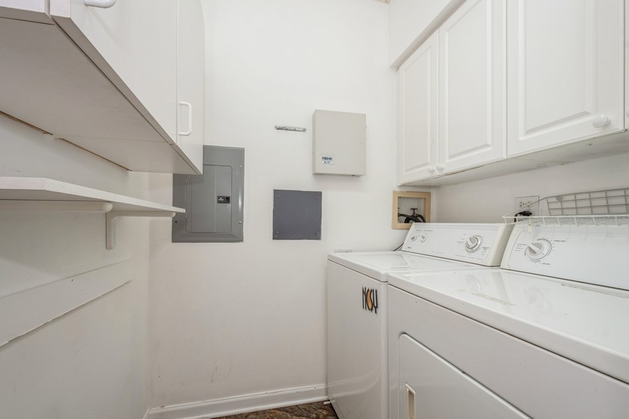 9220 East Prairie Road, Unit 303 Evanston, IL 60203 - Photo 10 of 13 a utility room with dryer and washer