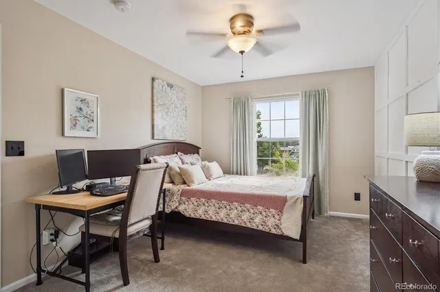 a bedroom with a bed and a table