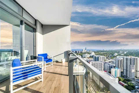 a view of balcony with furniture