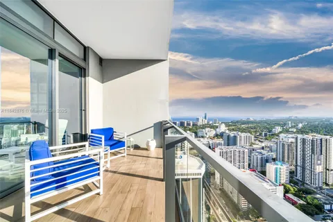 a view of balcony with furniture