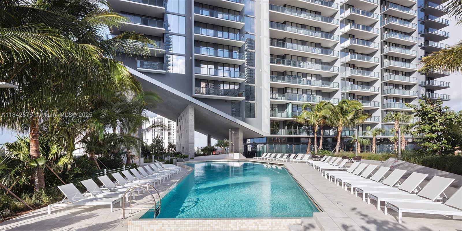 88 Southwest 7th Street, Unit 4004 Miami, FL 33130 - Photo 20 of 24 a view of a swimming pool with a patio