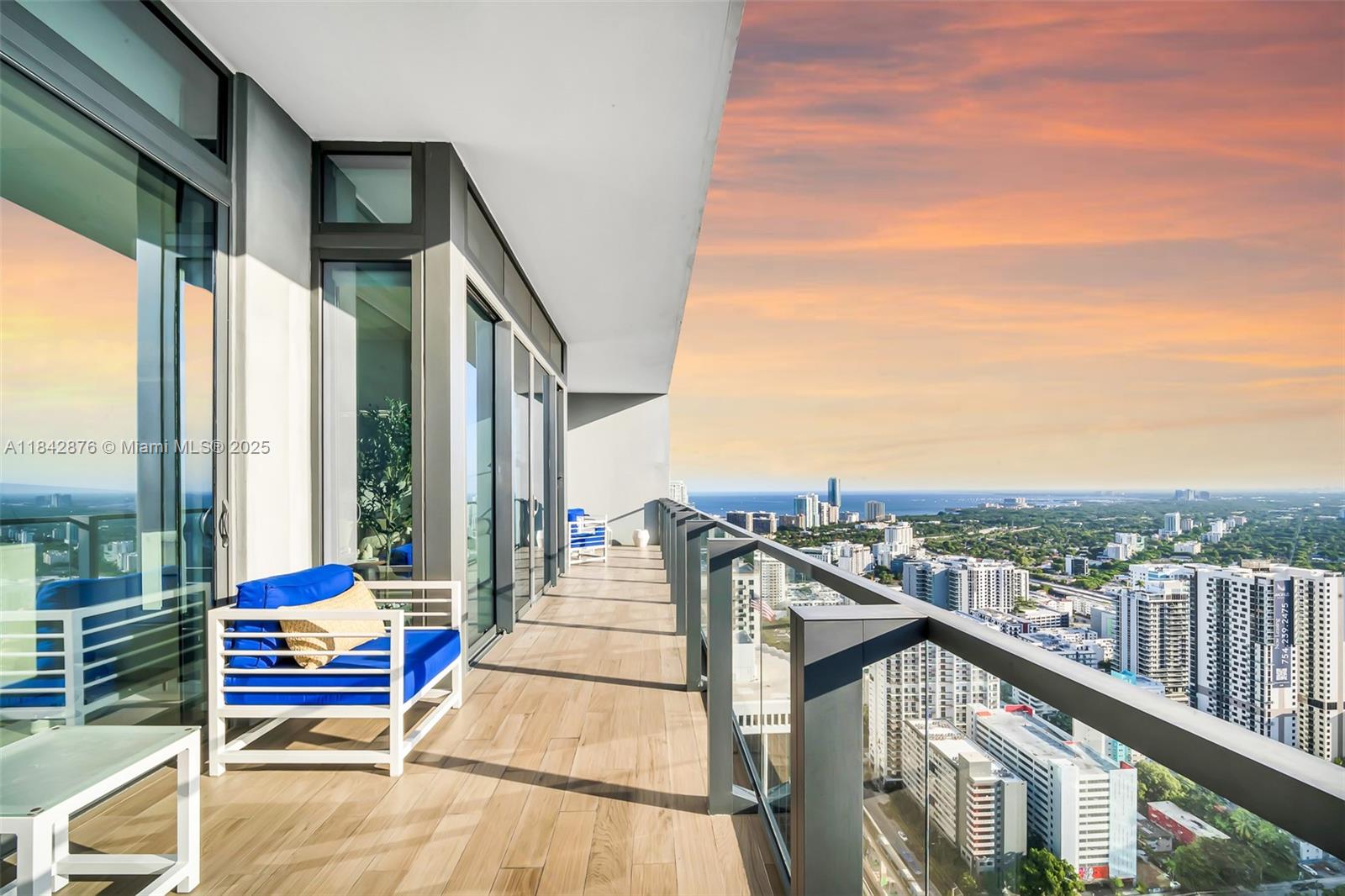 88 Southwest 7th Street, Unit 4004 Miami, FL 33130 - Photo 23 of 24 a balcony with wooden floor and city view
