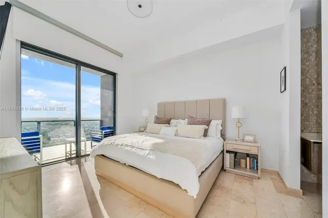 a bathroom with a granite countertop sink a toilet a mirror and bathtub