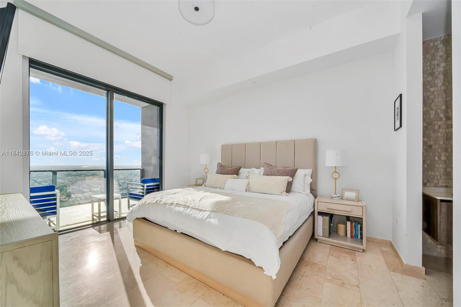 88 Southwest 7th Street, Unit 4004 Miami, FL 33130 - Photo 10 of 24 a bedroom with a bed and a large window