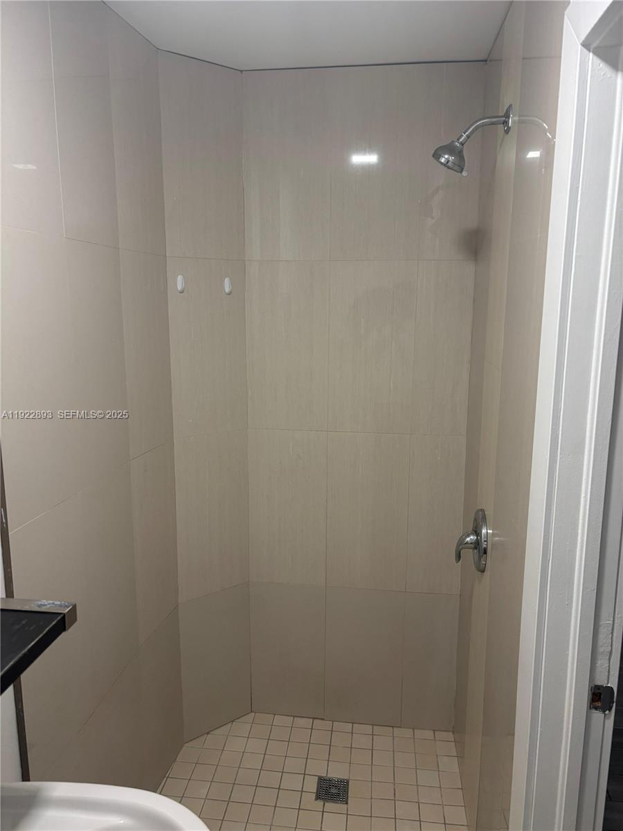 15535 Southwest 10th Street, Unit EFFICIENCY Miami, FL 33194 - Photo 6 of 10 a bathroom with a sink and toilet