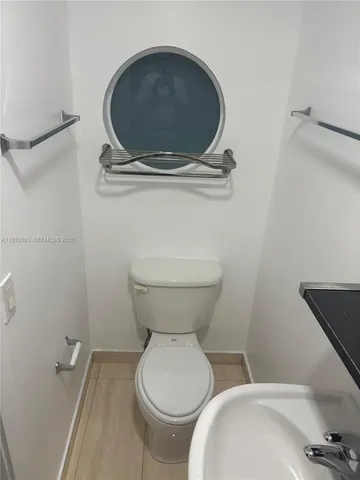 a bathroom with a toilet and a sink