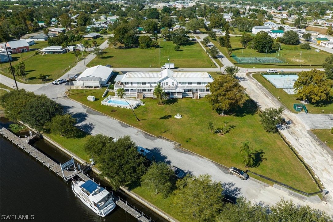 an aerial view of a residential houses with outdoor space