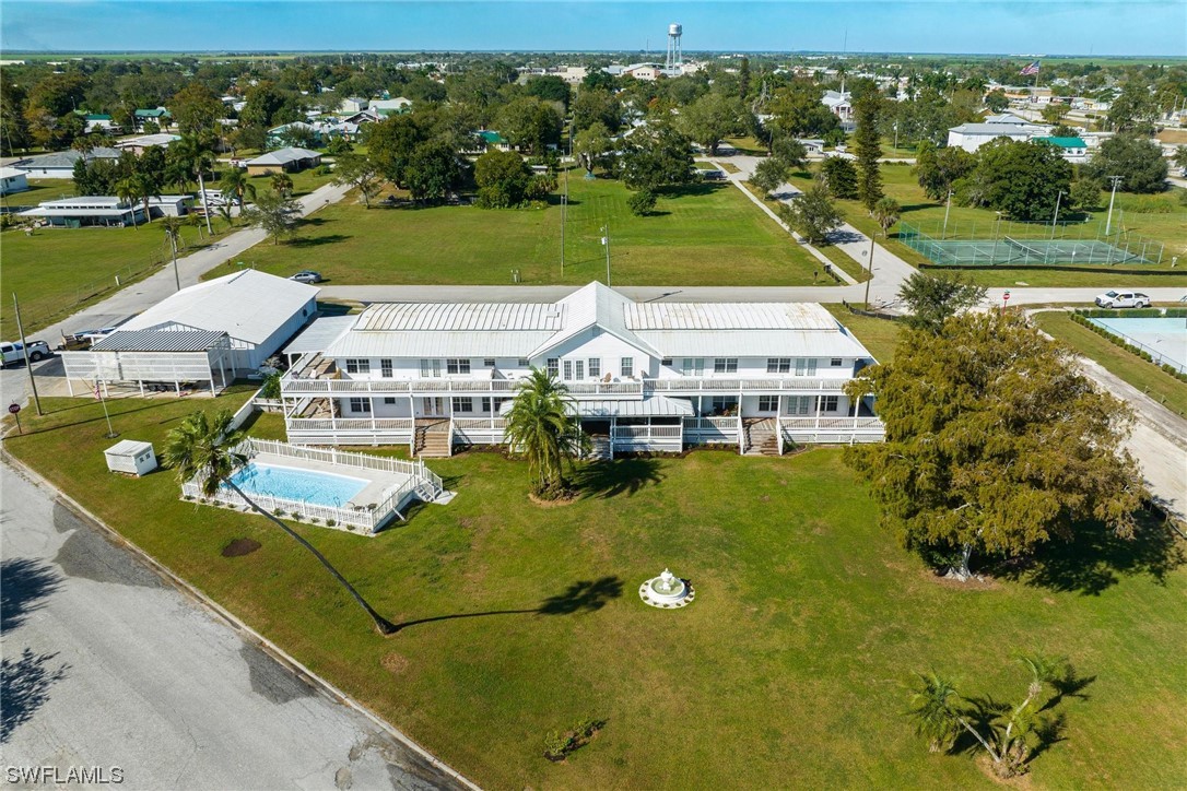 300 1st Street Moore Haven, FL 33471 - Photo 11 of 45 an aerial view of residential houses with outdoor space
