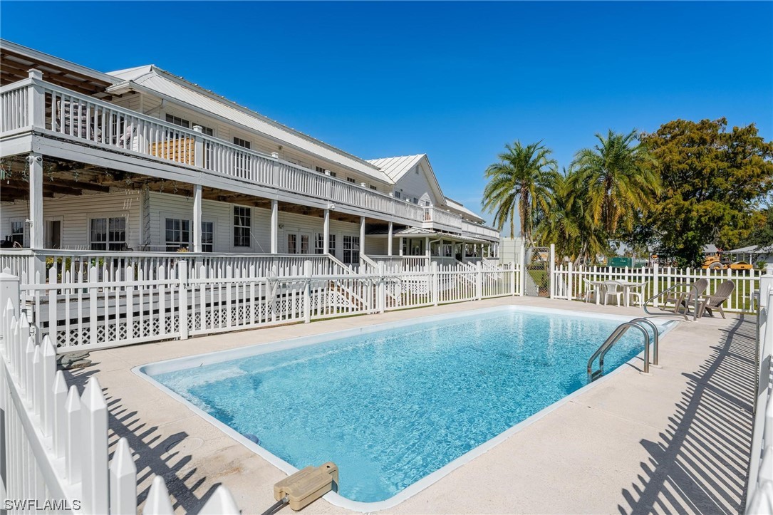 300 1st Street Moore Haven, FL 33471 - Photo 14 of 45 a view of a house with a wooden deck
