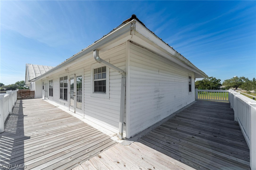 300 1st Street Moore Haven, FL 33471 - Photo 16 of 45 a view of a house with wooden deck