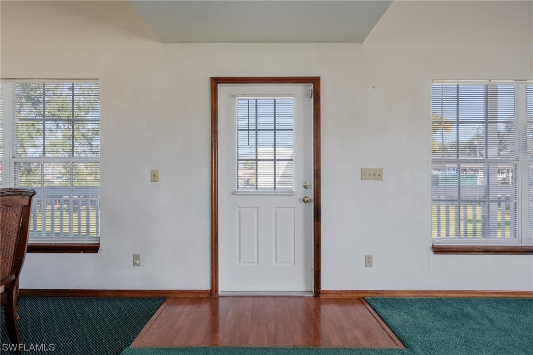 300 1st Street Moore Haven, FL 33471 - Photo 19 of 45 a view of an entryway with wooden floor