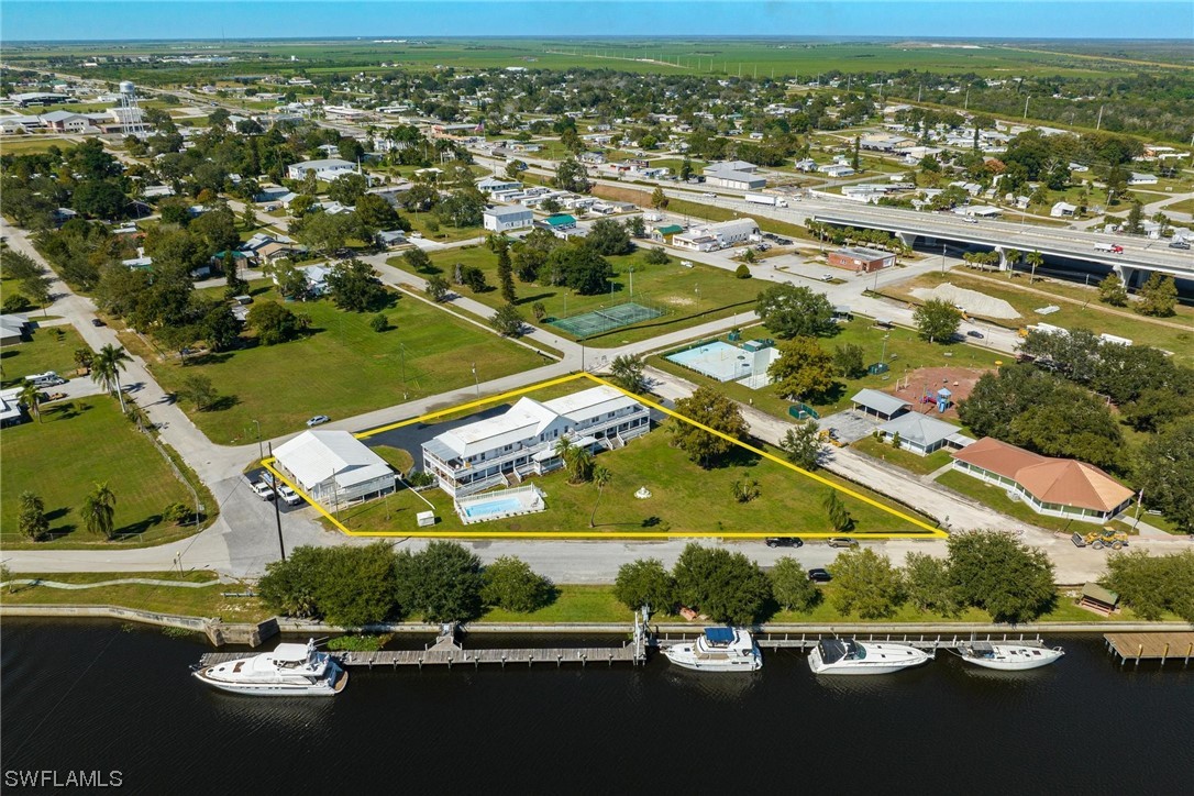 300 1st Street Moore Haven, FL 33471 - Photo 2 of 45 an aerial view of residential houses with outdoor space and river