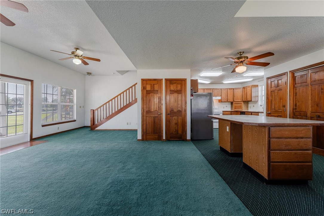 300 1st Street Moore Haven, FL 33471 - Photo 21 of 45 a view of a kitchen with refrigerator and cabinets