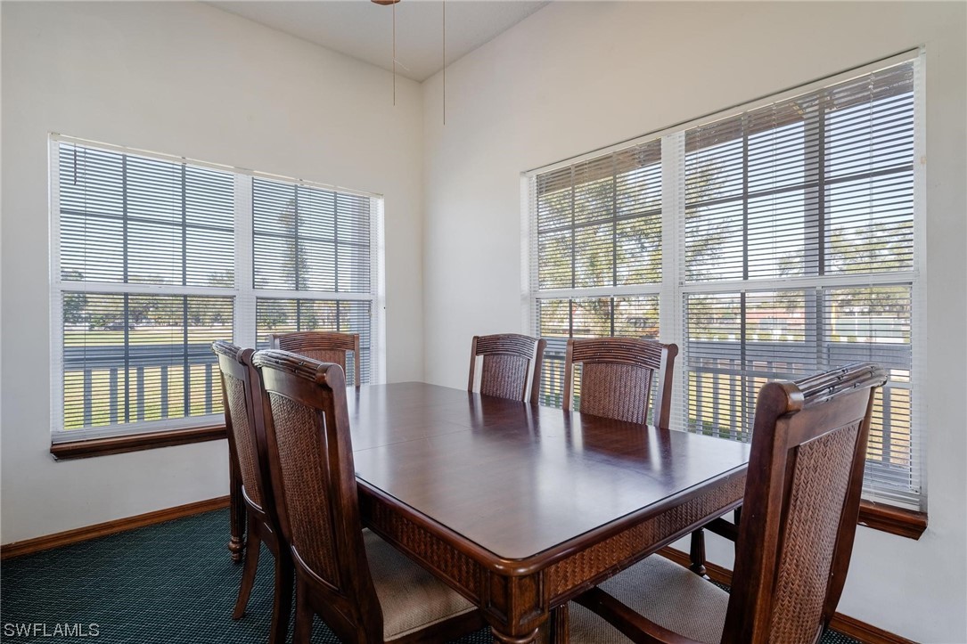 300 1st Street Moore Haven, FL 33471 - Photo 22 of 45 a view of a dining room with furniture and wooden floor