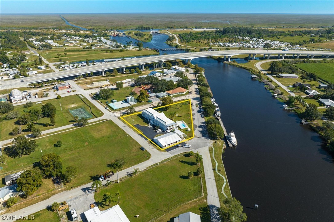300 1st Street Moore Haven, FL 33471 - Photo 3 of 45 an aerial view of a house with a ocean view